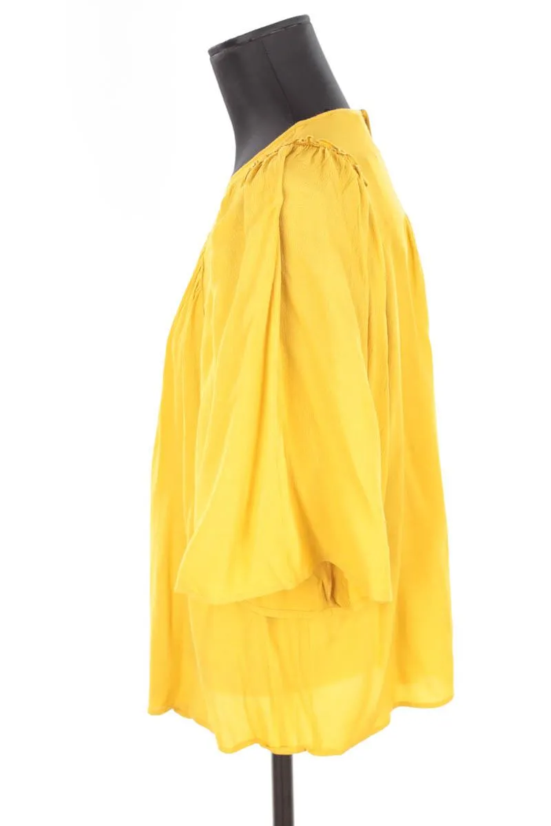 Blouse Bash jaune. Matière principale viscose. Taille 36.